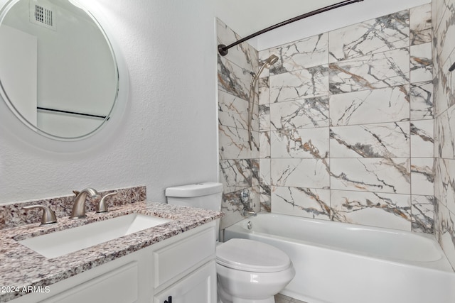 full bathroom featuring vanity, tiled shower / bath combo, and toilet