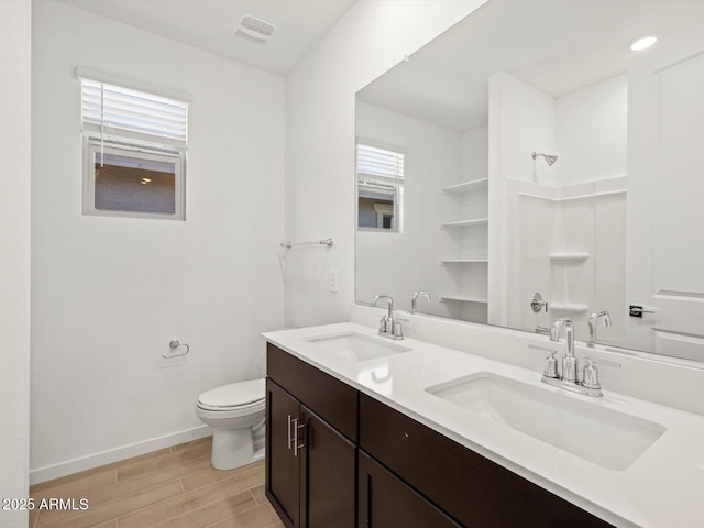 16081 W Remuda Dr, Surprise, AZ 85387 - bathroom featuring a wealth of natural light, a sink, and wood finished floors