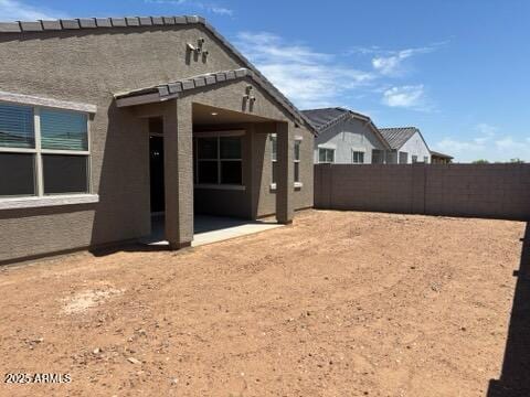 16081 W Remuda Dr, Surprise, AZ 85387 - back of property with a patio, a fenced backyard, and stucco siding