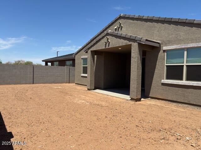 16081 W Remuda Dr, Surprise, AZ 85387 - rear view of property featuring stucco siding and fence