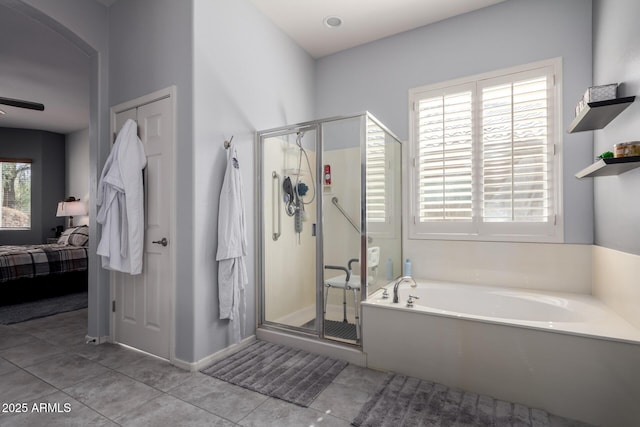 ensuite bathroom featuring ceiling fan, ensuite bathroom, tile patterned flooring, a shower stall, and a bath