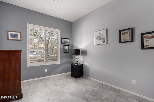 empty room featuring baseboards