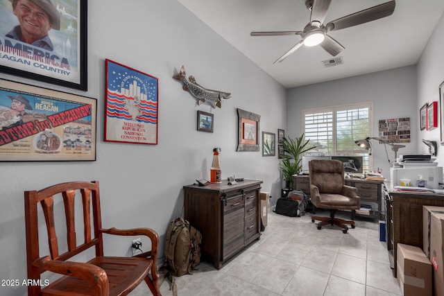 office space featuring light tile patterned floors, ceiling fan, and visible vents