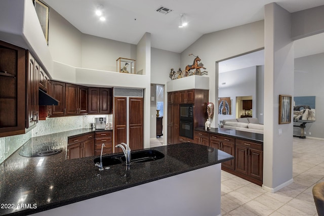 28897 N 94th Pl, Scottsdale, AZ 85262 - kitchen featuring a sink, high vaulted ceiling, a peninsula, built in appliances, and backsplash