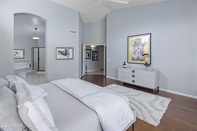 28897 N 94th Pl, Scottsdale, AZ 85262 - bedroom featuring wood finished floors, high vaulted ceiling, baseboards, arched walkways, and ensuite bathroom