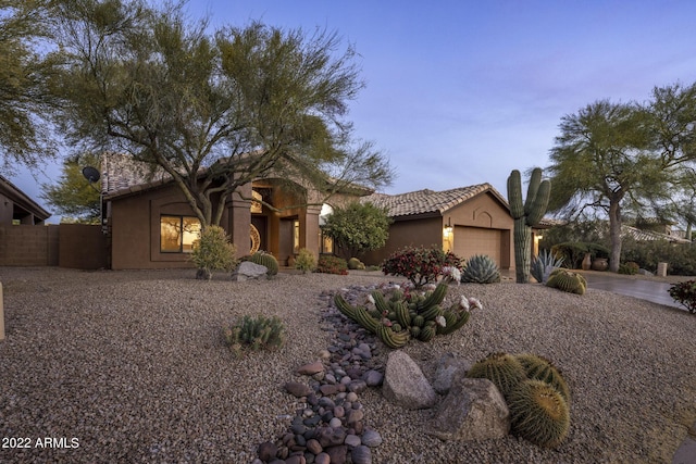 28897 N 94th Pl, Scottsdale, AZ 85262 - view of front of home featuring an attached garage, stucco siding, and a tile roof