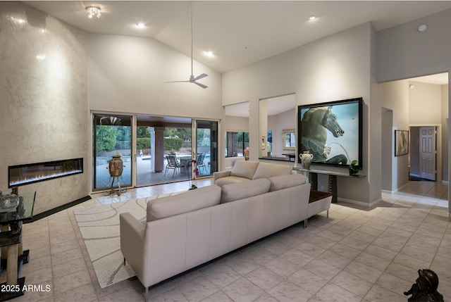 28897 N 94th Pl, Scottsdale, AZ 85262 - living room with high vaulted ceiling, a fireplace, ceiling fan, recessed lighting, and baseboards
