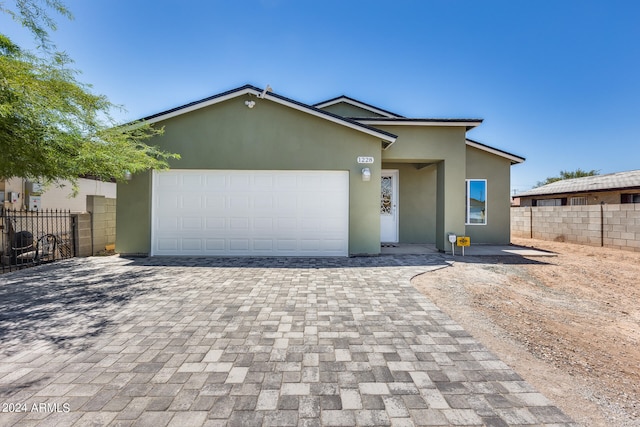 view of front of property with a garage