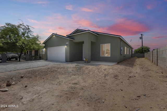 view of front of property with a garage