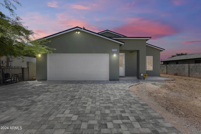 view of front of property with a garage