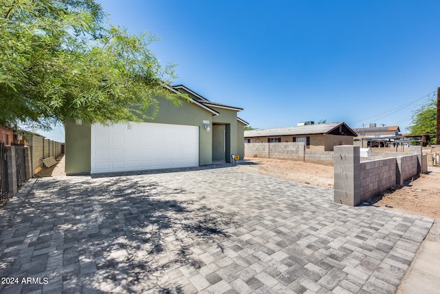 view of front of home with a garage