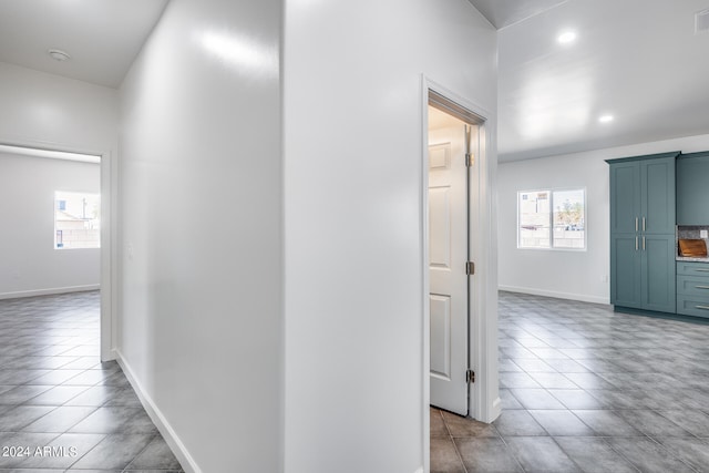 corridor featuring light tile patterned flooring