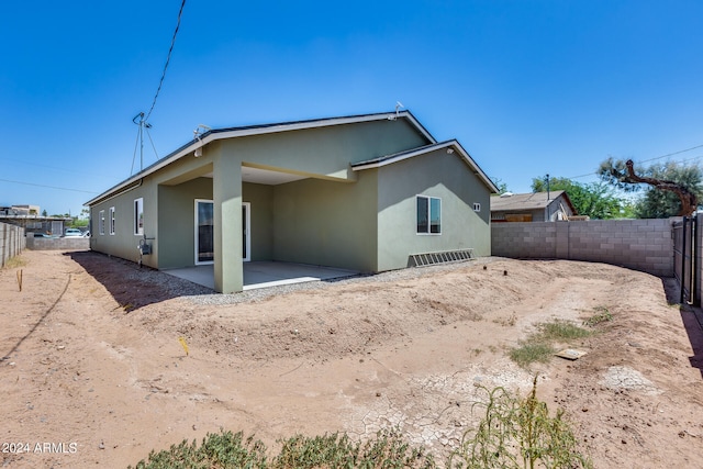 rear view of house featuring a patio