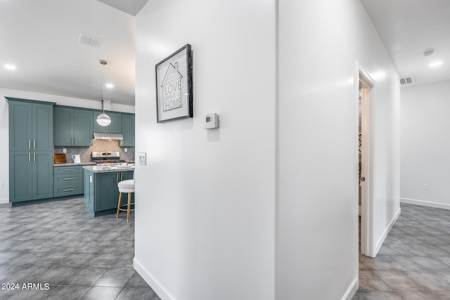 hallway with light tile patterned floors