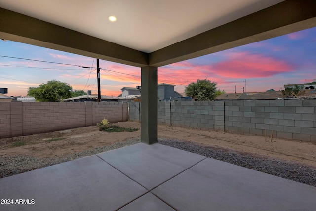 view of patio terrace at dusk