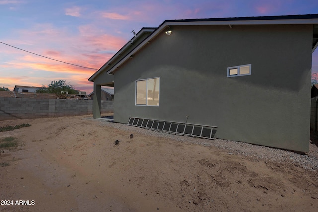 view of property exterior at dusk