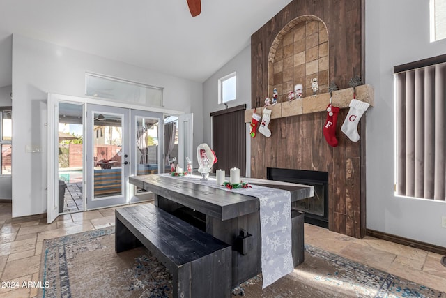 kitchen with ceiling fan, vaulted ceiling, and french doors