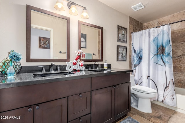 full bathroom featuring vanity, toilet, and shower / tub combo with curtain