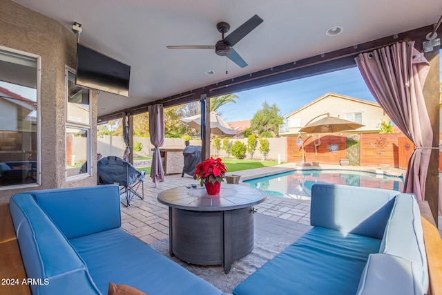 view of patio featuring an outdoor living space, a fenced in pool, ceiling fan, and grilling area