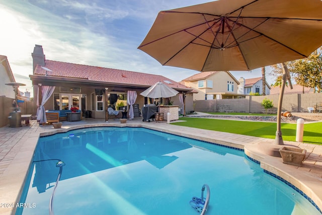 view of swimming pool with a patio