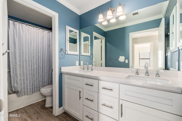 full bathroom featuring toilet, ornamental molding, vanity, shower / bath combo, and hardwood / wood-style floors