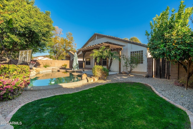 rear view of house with a fenced in pool, a patio, a yard, and a pergola