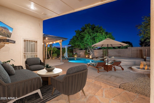 patio at night featuring a fenced in pool, a pergola, and a fire pit