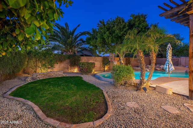 view of swimming pool with a lawn