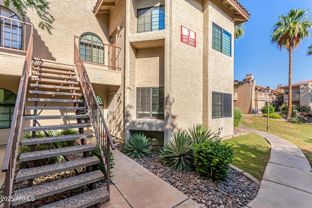 930 N Mesa Dr Unit 1023, Mesa, AZ 85201 - view of exterior entry with stucco siding and a residential view