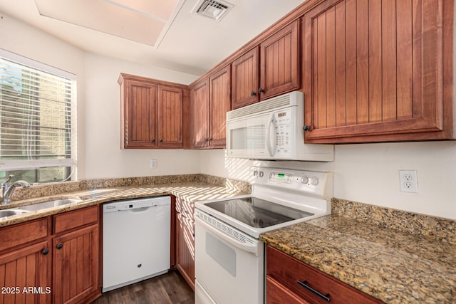 930 N Mesa Dr Unit 1023, Mesa, AZ 85201 - kitchen featuring white appliances, dark wood-type flooring, light stone countertops, and brown cabinets