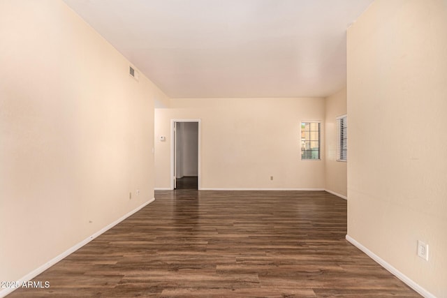 930 N Mesa Dr Unit 1023, Mesa, AZ 85201 - spare room featuring dark wood-type flooring and baseboards