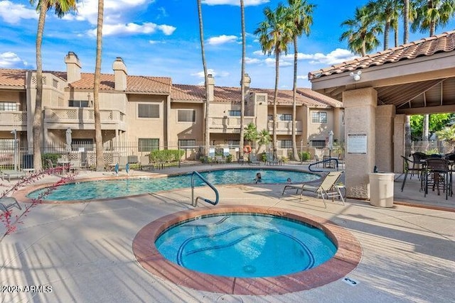 930 N Mesa Dr Unit 1023, Mesa, AZ 85201 - community pool with a patio, a residential view, and a hot tub