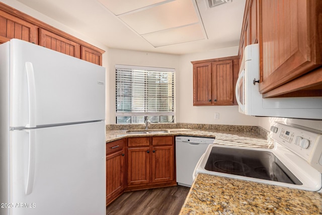 930 N Mesa Dr Unit 1023, Mesa, AZ 85201 - kitchen with white appliances, dark wood-type flooring, and brown cabinetry