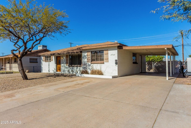 view of front of home with a carport