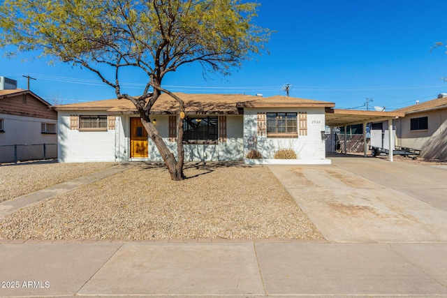 single story home featuring a carport