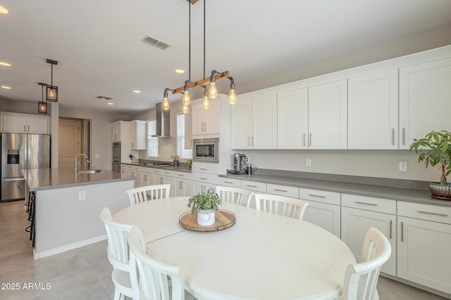 dining area with recessed lighting, visible vents, and light tile patterned flooring