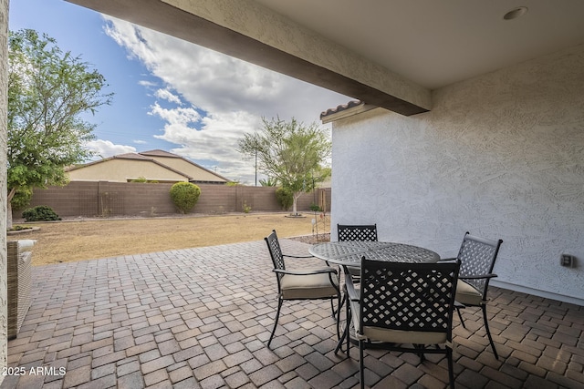 view of patio / terrace featuring a fenced backyard and outdoor dining space