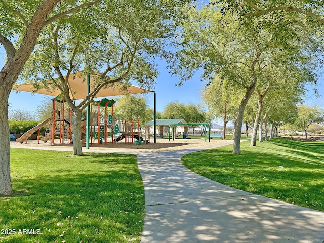 view of community with playground community and a yard