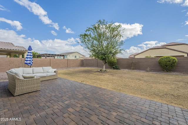 view of patio featuring outdoor lounge area and a fenced backyard