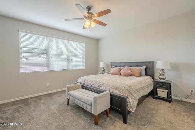 carpeted bedroom with baseboards and a ceiling fan