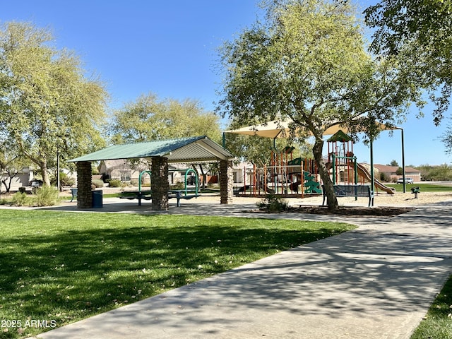 view of community with a lawn and playground community