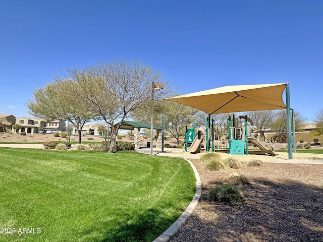 view of home's community with a lawn and playground community