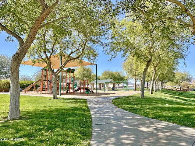 view of community with playground community and a lawn