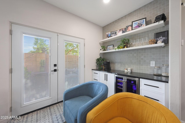 5439 W Odeum Ln, Phoenix, AZ 85043 - indoor dry bar with decorative backsplash and beverage cooler