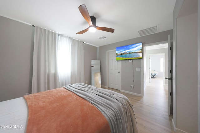 5439 W Odeum Ln, Phoenix, AZ 85043 - bedroom featuring light wood finished floors and a ceiling fan