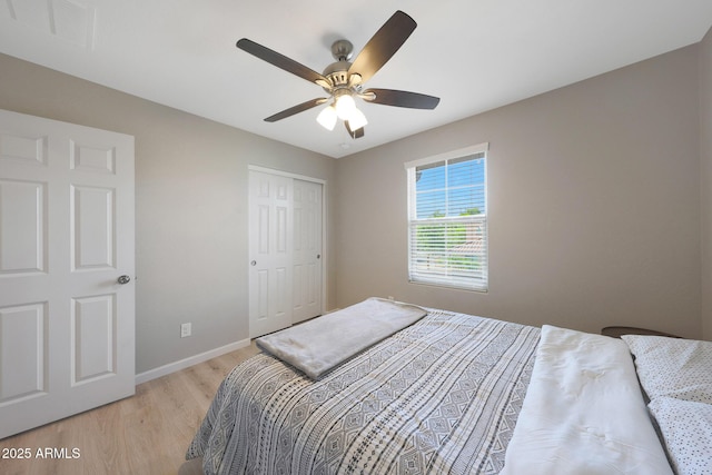 5439 W Odeum Ln, Phoenix, AZ 85043 - bedroom with light wood-style flooring, a closet, and a ceiling fan
