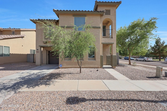 5439 W Odeum Ln, Phoenix, AZ 85043 - mediterranean / spanish-style house with stucco siding, concrete driveway, and a tiled roof
