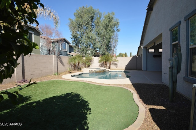 view of yard with a patio, a fenced backyard, and a pool with connected hot tub