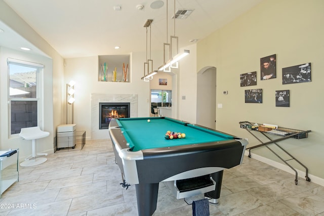 playroom with a premium fireplace and billiards