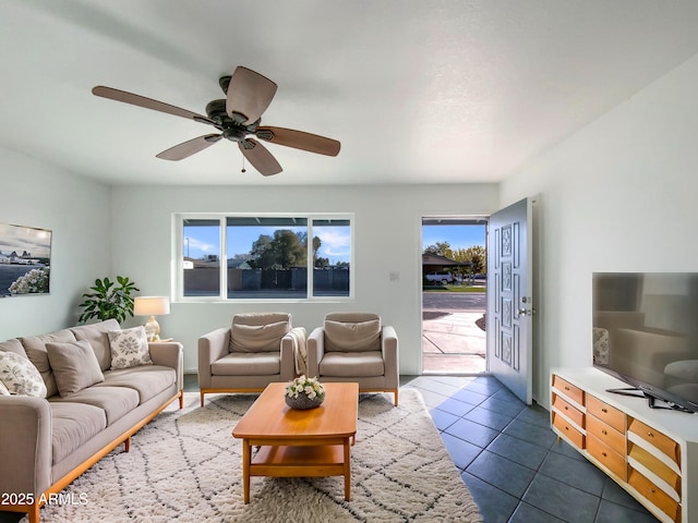 tiled living room with ceiling fan